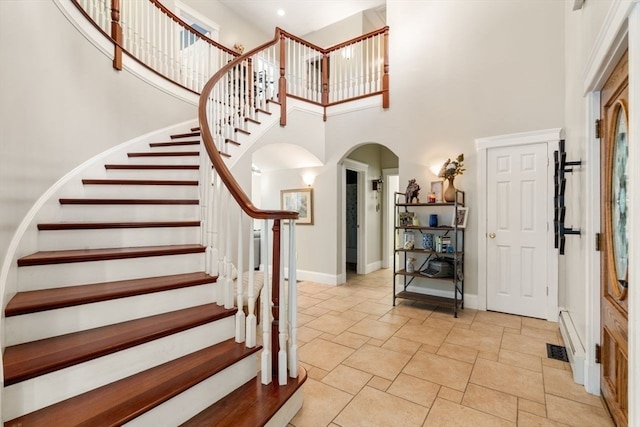 entryway with a high ceiling