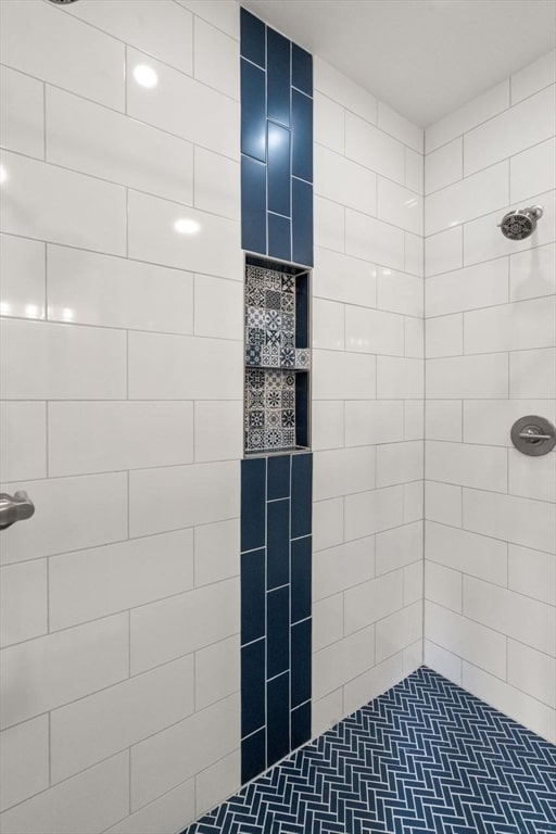 bathroom with tiled shower