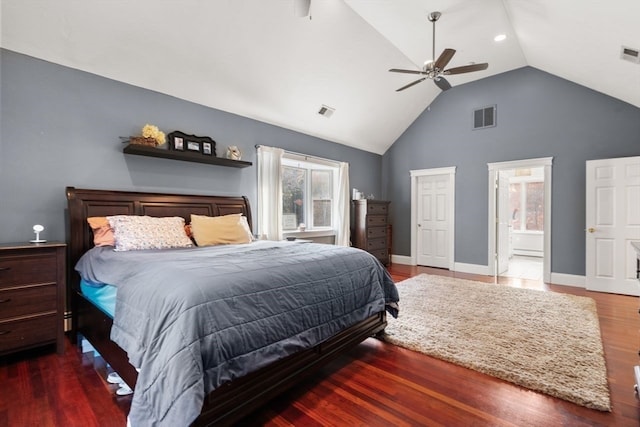 bedroom featuring ensuite bath, ceiling fan, dark hardwood / wood-style floors, and high vaulted ceiling