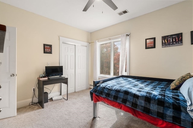 carpeted bedroom with a closet and ceiling fan