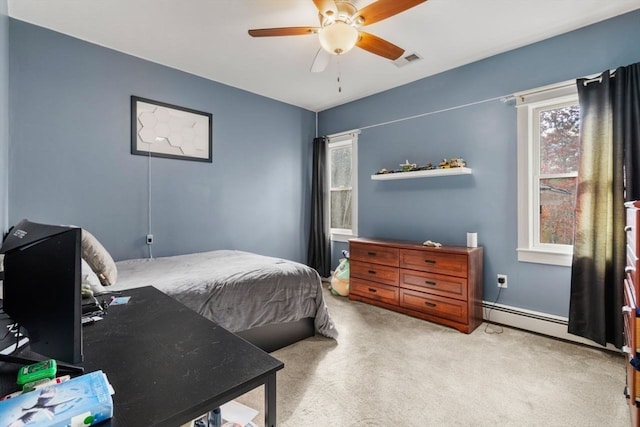 bedroom with ceiling fan, baseboard heating, and light colored carpet