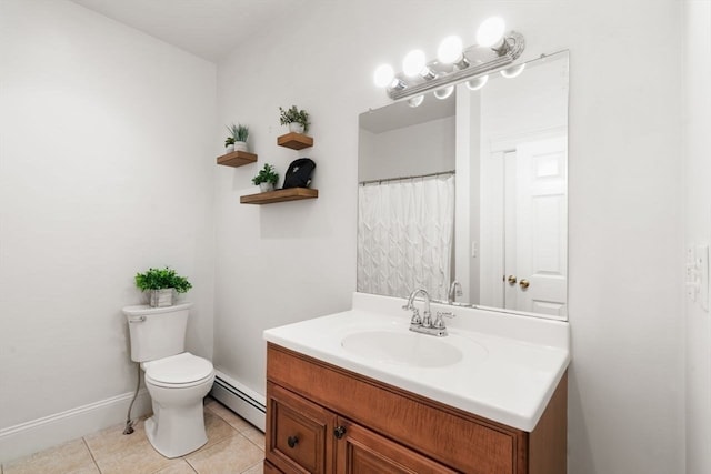 bathroom featuring toilet, vanity, tile patterned flooring, and baseboard heating