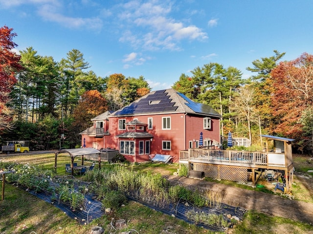 back of house with a wooden deck