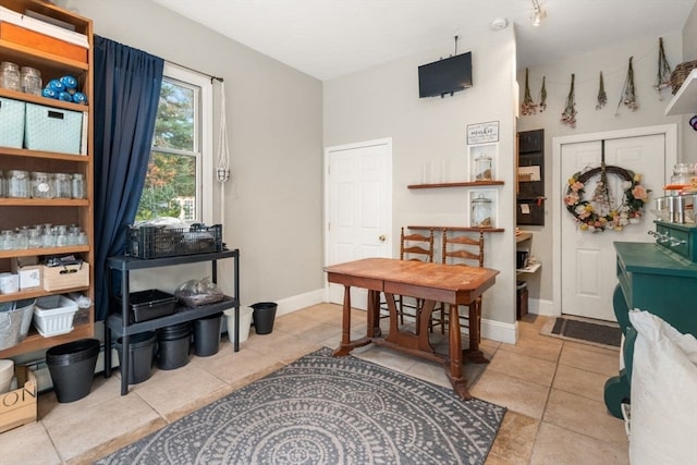 dining area featuring light tile patterned floors