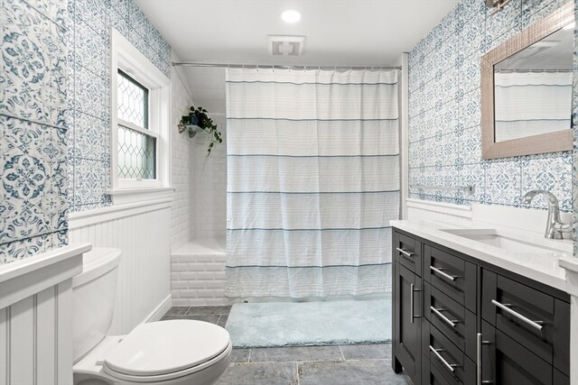 full bath featuring vanity, toilet, wallpapered walls, and curtained shower