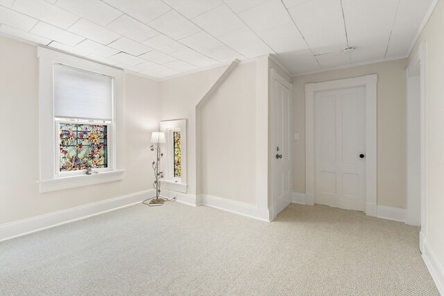 carpeted spare room with baseboards