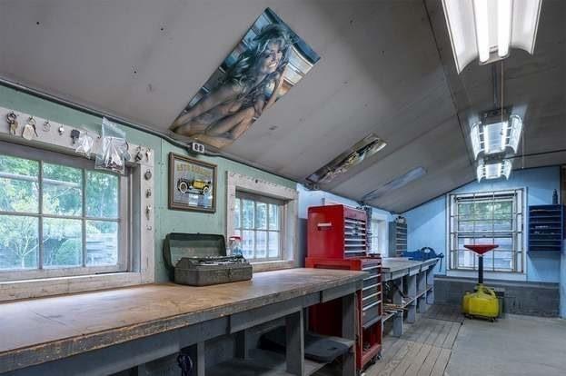 interior space featuring a workshop area and lofted ceiling