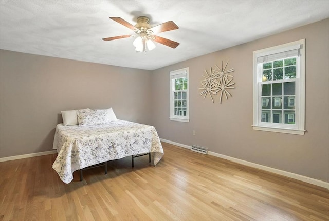 814 Wellman Ave Unit 814, Chelmsford, MA 01863 - bedroom with light wood-style floors and a ceiling fan