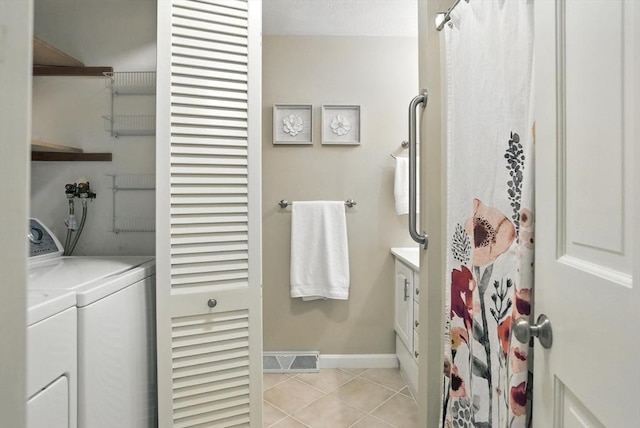 814 Wellman Ave Unit 814, Chelmsford, MA 01863 - full bathroom with vanity, tile patterned flooring, washer and clothes dryer, and a shower with curtain