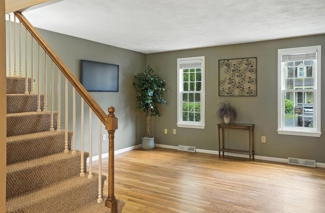 814 Wellman Ave Unit 814, Chelmsford, MA 01863 - entrance foyer featuring light wood-style floors and stairway