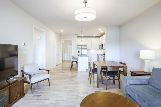 dining room featuring light hardwood / wood-style flooring