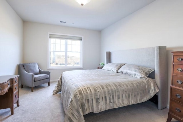 bedroom featuring light carpet