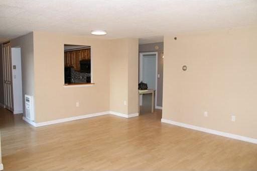 spare room with light hardwood / wood-style floors