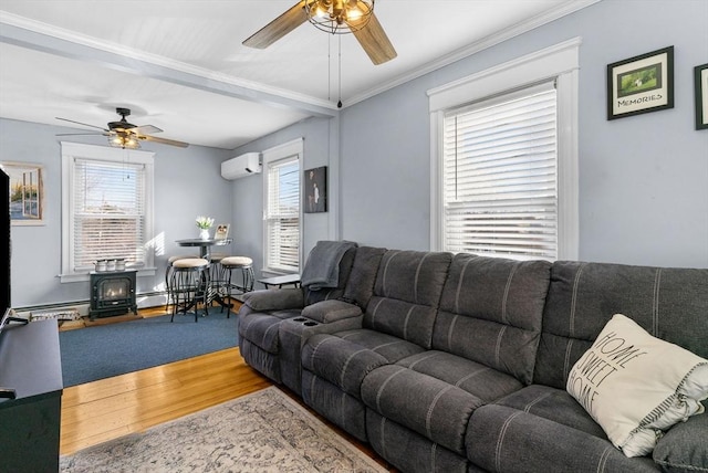 living room with wood finished floors, ceiling fan, a wood stove, and a wall mounted AC