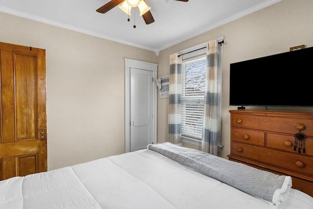 bedroom with crown molding and a ceiling fan