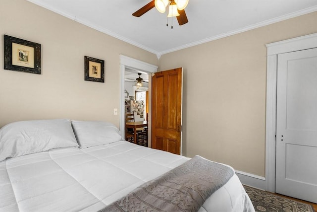 bedroom featuring baseboards, ceiling fan, and ornamental molding