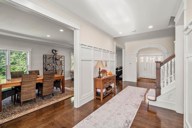 entryway featuring crown molding and dark wood-type flooring