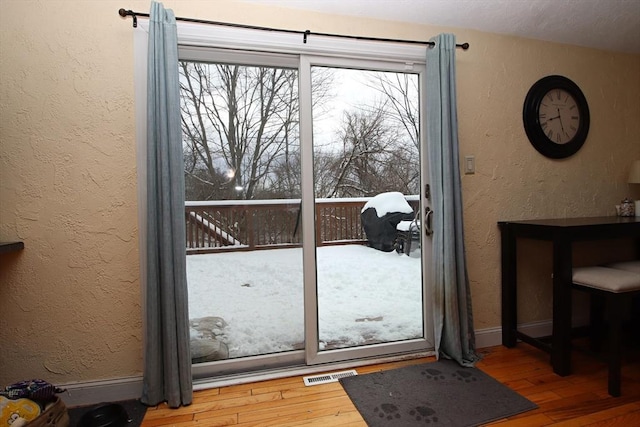 doorway to outside with hardwood / wood-style flooring