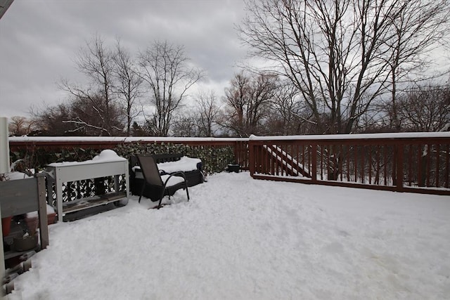 view of snow covered deck