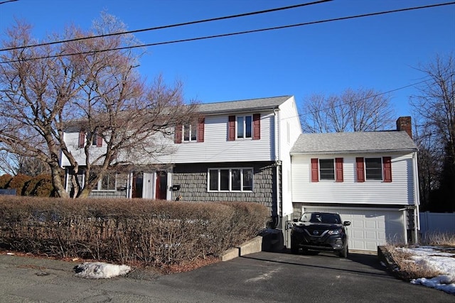 view of front of property with a garage