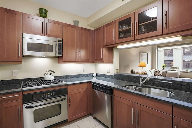 1 Charles St S Unit 602, Boston, MA 02116 - kitchen with stainless steel appliances, a sink, dark stone countertops, and glass insert cabinets