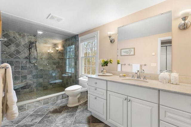 full bath featuring visible vents, toilet, vanity, and a tile shower