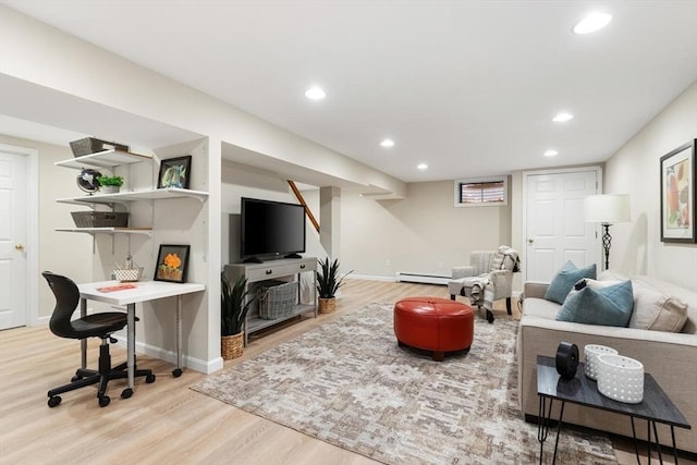 living area featuring recessed lighting, a baseboard heating unit, baseboards, and wood finished floors