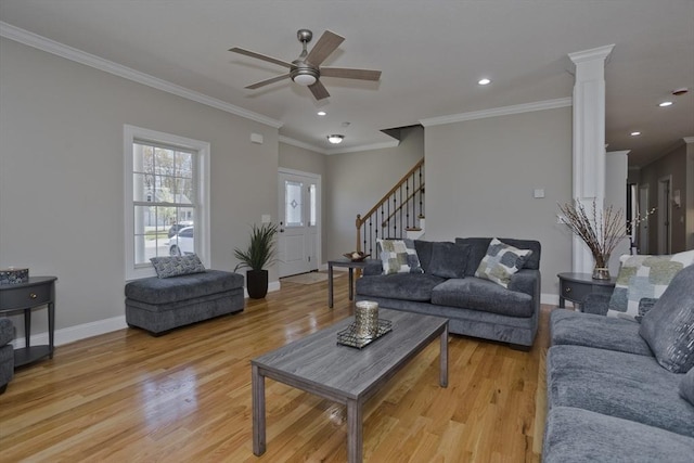 15 Fernwood Dr, East Longmeadow, MA 01028 - living area featuring light wood-type flooring, a ceiling fan, baseboards, stairs, and decorative columns