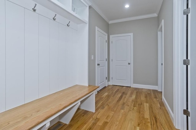 15 Fernwood Dr, East Longmeadow, MA 01028 - mudroom featuring light wood finished floors, ornamental molding, and baseboards