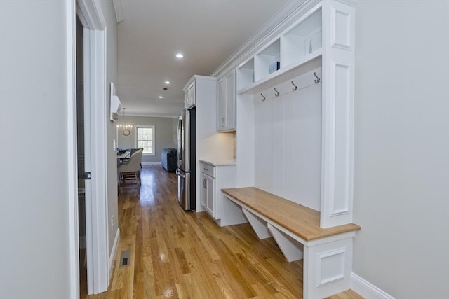 15 Fernwood Dr, East Longmeadow, MA 01028 - mudroom featuring light wood finished floors, ornamental molding, baseboards, and recessed lighting