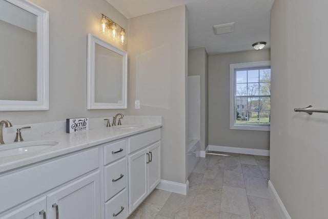 15 Fernwood Dr, East Longmeadow, MA 01028 - full bath with baseboards, double vanity, and a tub to relax in
