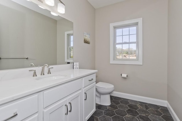 15 Fernwood Dr, East Longmeadow, MA 01028 - bathroom with toilet, vanity, tile patterned flooring, and baseboards