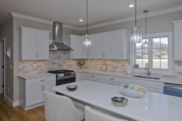 15 Fernwood Dr, East Longmeadow, MA 01028 - kitchen with wall chimney range hood, a sink, stainless steel gas range, wood finished floors, and white cabinetry