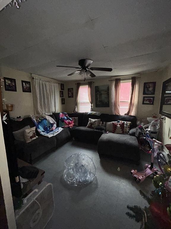 living room featuring ceiling fan