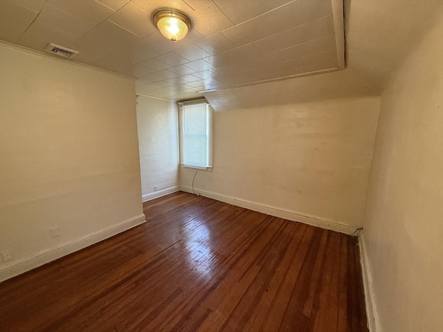 additional living space featuring dark hardwood / wood-style flooring