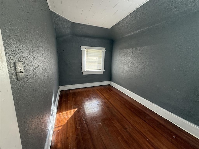 unfurnished room with hardwood / wood-style flooring