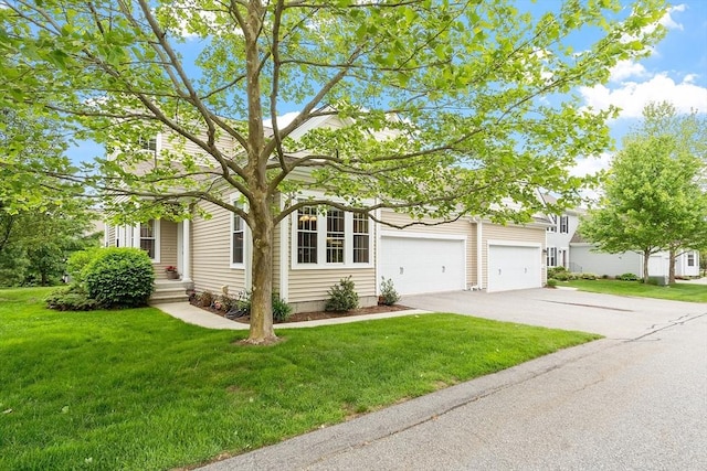 17 Ryder Path Unit 17, Acton, MA 01720 - view of property hidden behind natural elements with driveway, a front lawn, and a garage