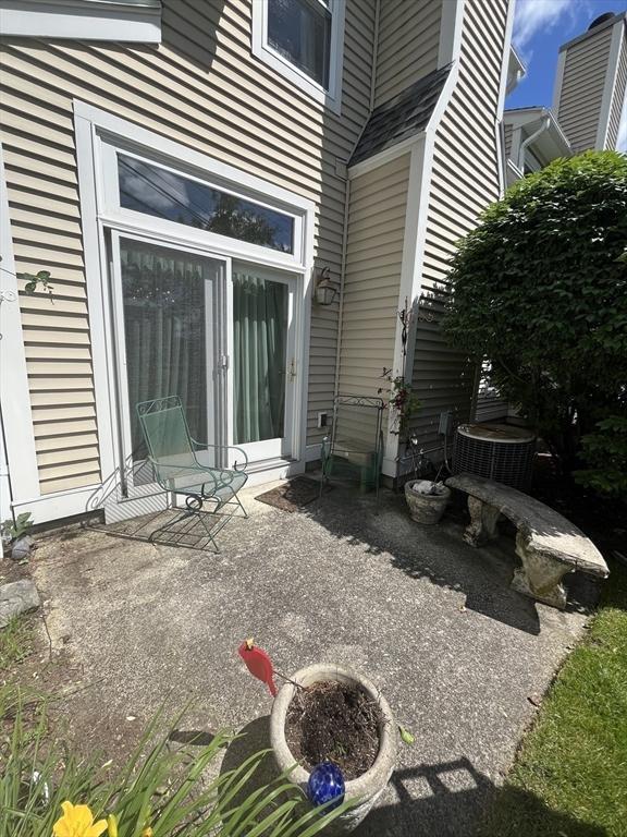 38 Hammond Pl Unit 38, Woburn, MA 01801 - view of exterior entry featuring a patio area