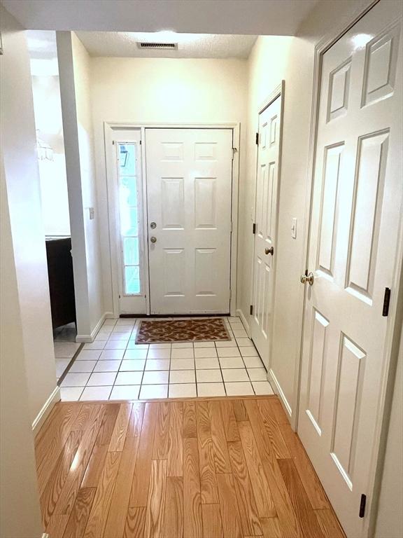 38 Hammond Pl Unit 38, Woburn, MA 01801 - entrance foyer with baseboards and light tile patterned flooring