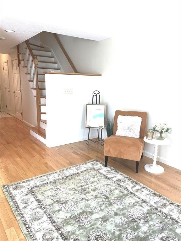 38 Hammond Pl Unit 38, Woburn, MA 01801 - living area with stairway and wood finished floors