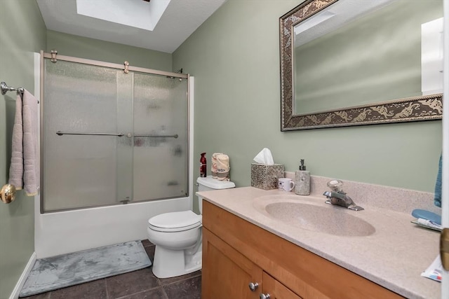 full bathroom with toilet, bath / shower combo with glass door, a skylight, vanity, and tile patterned flooring