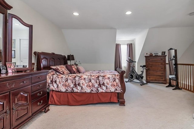 carpeted bedroom with vaulted ceiling