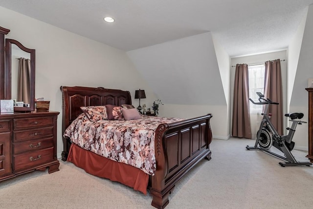 carpeted bedroom featuring lofted ceiling