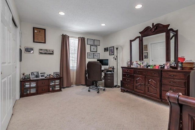 office area featuring light carpet