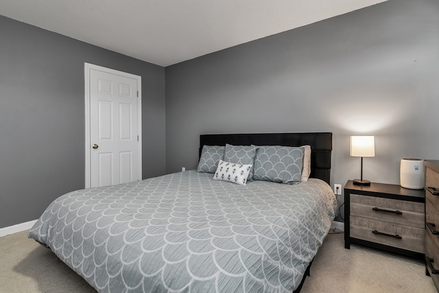 bedroom with light carpet