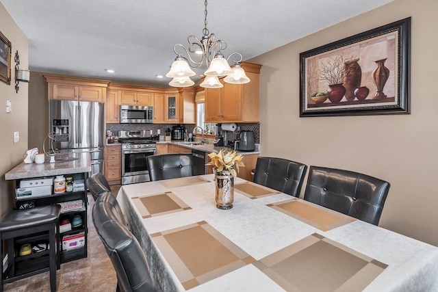 dining room with an inviting chandelier and sink