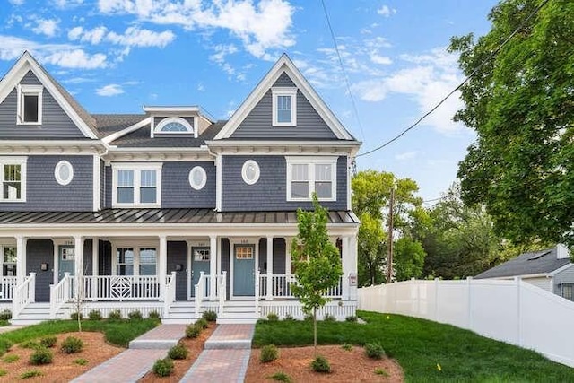162 Swanton St Unit 162, Winchester, MA 01890 - view of front facade featuring a standing seam roof, covered porch, and metal roof