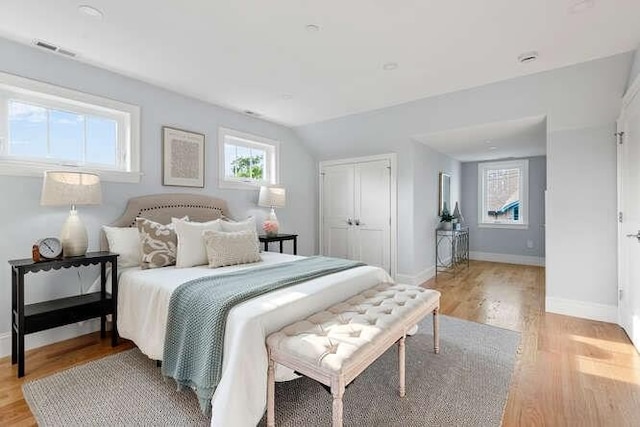 162 Swanton St Unit 162, Winchester, MA 01890 - bedroom featuring light wood-style floors, baseboards, and a closet