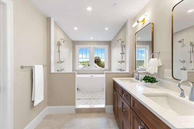 162 Swanton St Unit 162, Winchester, MA 01890 - full bathroom with a freestanding bath, double vanity, recessed lighting, baseboards, and a shower