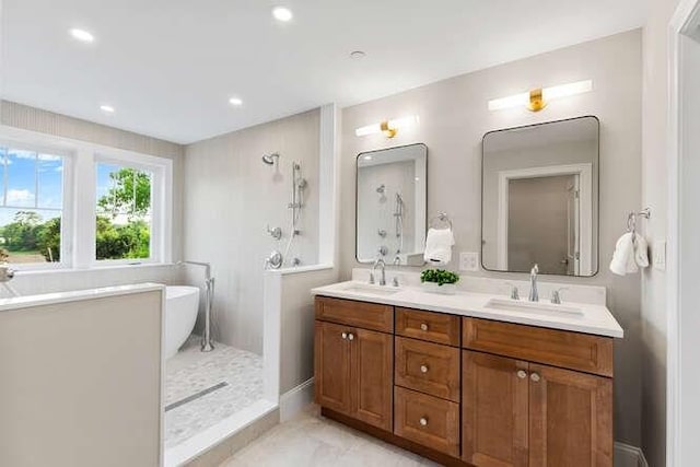 162 Swanton St Unit 162, Winchester, MA 01890 - bathroom with double vanity, a soaking tub, recessed lighting, and a shower